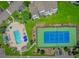 Aerial view of a community pool, tennis court, and parking at 4018 Fairway Lakes Dr. # 4018, Myrtle Beach, SC 29577