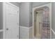 Bathroom features a shower with a curtain and white door at 4018 Fairway Lakes Dr. # 4018, Myrtle Beach, SC 29577