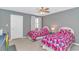 Cozy bedroom featuring two twin beds with bright, floral comforters and neutral decor at 4018 Fairway Lakes Dr. # 4018, Myrtle Beach, SC 29577