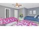 Neutral-toned bedroom featuring twin beds, TV, and closet space at 4018 Fairway Lakes Dr. # 4018, Myrtle Beach, SC 29577