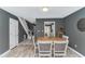 Inviting dining room with wood table and gray walls, adjacent to the staircase and with kitchen view at 4018 Fairway Lakes Dr. # 4018, Myrtle Beach, SC 29577