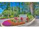 Community entrance sign surrounded by colorful flowers and lush greenery at 4018 Fairway Lakes Dr. # 4018, Myrtle Beach, SC 29577