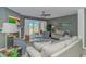 Comfortable living room features a fireplace, ceiling fan, and access to an outdoor deck with a scenic view at 4018 Fairway Lakes Dr. # 4018, Myrtle Beach, SC 29577