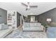 Comfortable living room showcasing a bookshelf, gray walls, and open layout to dining area and staircase at 4018 Fairway Lakes Dr. # 4018, Myrtle Beach, SC 29577