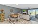 Open-concept living and dining area with fireplace, TV, patio access, and contemporary furnishings at 4018 Fairway Lakes Dr. # 4018, Myrtle Beach, SC 29577