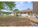 Sprawling backyard with a well-maintained lawn and mature trees at 415 42Nd Ave. N, Myrtle Beach, SC 29577