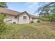 Backyard with grass and view of the exterior of the house at 415 42Nd Ave. N, Myrtle Beach, SC 29577