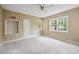 Bedroom featuring built-in shelves and natural light from two windows at 415 42Nd Ave. N, Myrtle Beach, SC 29577
