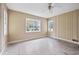 Bedroom with ceiling fan and natural light from two windows at 415 42Nd Ave. N, Myrtle Beach, SC 29577