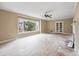 Bright living room with large windows, fireplace, and glass doors at 415 42Nd Ave. N, Myrtle Beach, SC 29577