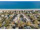 Sweeping aerial view of building and ocean front access with ample parking at 423 Parker Dr. # 613, Pawleys Island, SC 29585