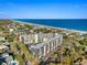 Drone shot of the condo building highlighting beach access and ocean views at 423 Parker Dr. # 613, Pawleys Island, SC 29585