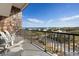 Comfortable balcony with seating boasting views of the ocean and surrounding homes at 423 Parker Dr. # 613, Pawleys Island, SC 29585