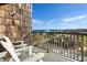 Relaxing balcony with chairs overlooking the ocean and neighborhood at 423 Parker Dr. # 613, Pawleys Island, SC 29585