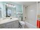 Clean bathroom features a shower-tub combo, vanity with sink and linen storage at 423 Parker Dr. # 613, Pawleys Island, SC 29585