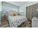 This coastal bedroom features a Queen bed with wood-style floors and plenty of natural light at 423 Parker Dr. # 613, Pawleys Island, SC 29585