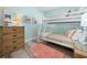 Light-filled room with a bunk bed, wicker dresser and colorful decor accents at 423 Parker Dr. # 613, Pawleys Island, SC 29585