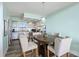 Inviting eat-in kitchen area featuring stainless steel appliances, a breakfast bar, and ample storage at 423 Parker Dr. # 613, Pawleys Island, SC 29585