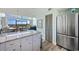 Open-concept space featuring a stainless steel refrigerator and an open view of living room at 423 Parker Dr. # 613, Pawleys Island, SC 29585