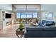 Well-lit living room features a fireplace, large windows, and beautiful ocean views at 423 Parker Dr. # 613, Pawleys Island, SC 29585