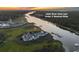 Aerial view of a coastal community near the Little River Inlet featuring a private boat dock at 4525 Landing Rd., Little River, SC 29566