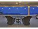 Enjoy views of the neighborhood from the back porch with decorative lighting and outdoor furniture at 4525 Landing Rd., Little River, SC 29566