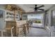 Entertain friends at the tiki-style bar with a view of the covered patio and back yard at 4525 Landing Rd., Little River, SC 29566