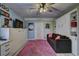Stylish basement featuring a pull-down bed, a comfortable sofa, and eye-catching decor at 4525 Landing Rd., Little River, SC 29566