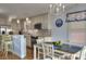 A well-lit kitchen featuring stainless steel appliances and a dining table with seating for four at 4525 Landing Rd., Little River, SC 29566