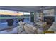 Bright living room with a fireplace, comfortable seating, and sliding doors to the back porch at 4525 Landing Rd., Little River, SC 29566