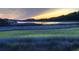 Picturesque marsh view at sunset with a wooden walkway, peaceful river, and setting sun at 4525 Landing Rd., Little River, SC 29566