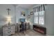Cozy home office space with a desk, chair, and a modern electric fireplace at 4525 Landing Rd., Little River, SC 29566
