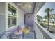 Relaxing porch featuring comfortable seating and tropical decor, perfect for enjoying the outdoor views at 4525 Landing Rd., Little River, SC 29566