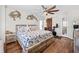 Serene bedroom with wood accents, ceiling fan, sliding barn door, and nautical themed decor at 4534 Landing Rd., Little River, SC 29566
