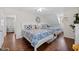 Spacious bedroom with two beds, hardwood floors, nautical decor and ample natural light at 4534 Landing Rd., Little River, SC 29566
