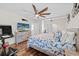 Relaxing bedroom features a ceiling fan, natural light, and nautical themed decor at 4534 Landing Rd., Little River, SC 29566