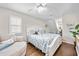 Cozy bedroom with a comfortable bed, soft armchair, and natural light creating a serene retreat at 4534 Landing Rd., Little River, SC 29566