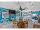 Fun dining area with a glass table, ceiling fans, and a serving bar for easy entertaining at 4534 Landing Rd., Little River, SC 29566