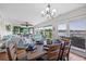 Dining area with wood table, seating and place settings; open to the spacious living area at 4534 Landing Rd., Little River, SC 29566