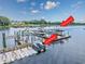 Home featuring a boat dock/lift and a Jet Ski dock for all your water activities at 4534 Landing Rd., Little River, SC 29566