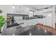 Well-lit kitchen features white cabinetry, stainless appliances, granite countertops, and a stylish backsplash at 4534 Landing Rd., Little River, SC 29566