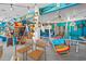 Playful recreation room featuring a ping pong table, multiple hammocks, and bar area for entertaining at 4534 Landing Rd., Little River, SC 29566