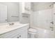 Bright white bathroom featuring a shower-tub combination and a white single sink vanity at 4721 Hibiscus Dr. # 3-302, Little River, SC 29566