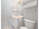 Cozy bathroom featuring a single sink vanity with a framed mirror and white cabinet storage at 4721 Hibiscus Dr. # 3-302, Little River, SC 29566