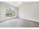 Bright bedroom with a large window providing natural light, creating a serene and airy space at 4721 Hibiscus Dr. # 3-302, Little River, SC 29566