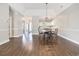 Open dining room with hardwood floors and views of the kitchen area creates an inviting atmosphere at 4721 Hibiscus Dr. # 3-302, Little River, SC 29566