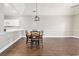 Open dining area with hardwood floors and eat in kitchen at 4721 Hibiscus Dr. # 3-302, Little River, SC 29566