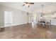 Expansive living room features hardwood floors and an open concept design, perfect for entertaining at 4721 Hibiscus Dr. # 3-302, Little River, SC 29566
