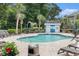 Community swimming pool surrounded by palm trees and lounge chairs at 4721 Hibiscus Dr. # 3-302, Little River, SC 29566