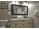 Well-lit bathroom with double sinks, granite countertops, and a neutral color scheme at 4901 N Market St., North Myrtle Beach, SC 29582
